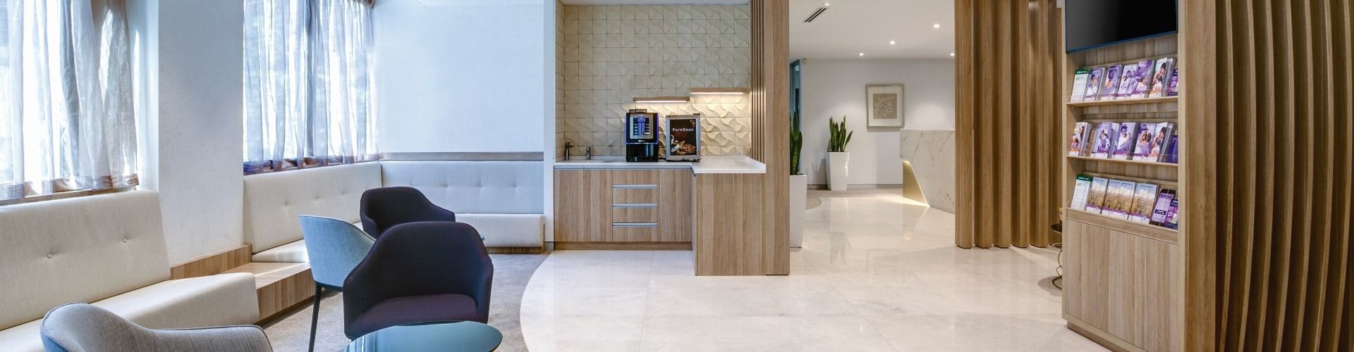 Contemporary and functional hospital waiting room designed by healthcare design experts with a warm atmosphere for patients